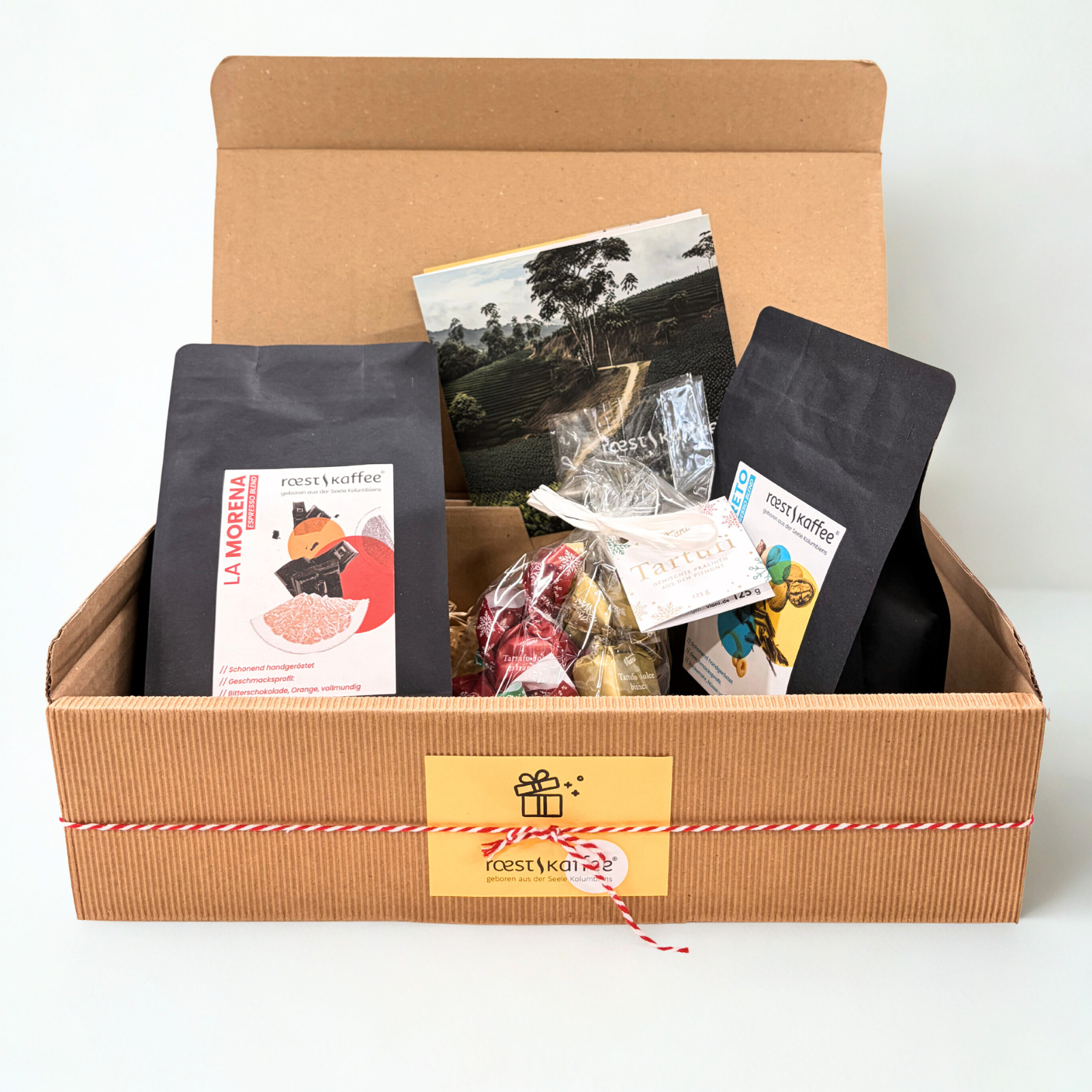 Geschenkset La Pinta von roestkaffee mit 2x 250g Kaffee und Tartufi, stilvoll verpackt als Geschenk für Kaffeeliebhaber.